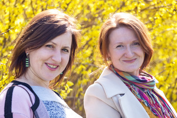 two smiling girlfriend portrait