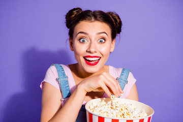 Sticker - Close up photo beautiful amazing she her lady big eyes funky buns watch famous comedy tv show hold popcorn bucket wear casual t-shirt jeans denim overalls clothes isolated purple violet background