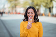 © bnenin - Millennial woman eating ice cream on a spring sunny day.