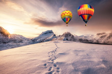 Hot Air Balloons Flying On Snowy Mountain With Footprint On Peak