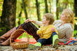 © be free - Happy spring day. Spring mood. Happy family day. Sunny weather. Healthy food. Happy son with mother relax in autumn forest. Family picnic. Mothers day. Mother love her small boy child