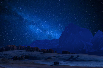 Wall Mural - stars and distant galaxies above mountains
