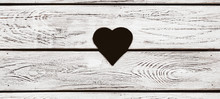 Heart Shaped Hole In The Wooden Background With Copy Space