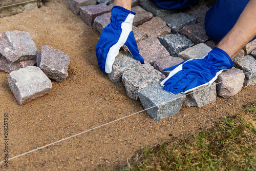 Cuadros en Lienzo cobblestone installation - paver laying granite stone pavers