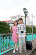 © makistock - Young happy Asian couple tourist enjoy on summer holiday traveling in Saigon, Vietnam