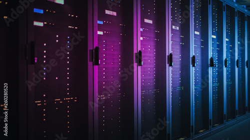 Cuadros en Lienzo Shot of Dark Data Center With Multiple Rows of Fully Operational Server Racks