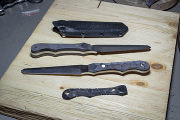 Wall Mural - Unfinished custom stiletto knives with handle covers