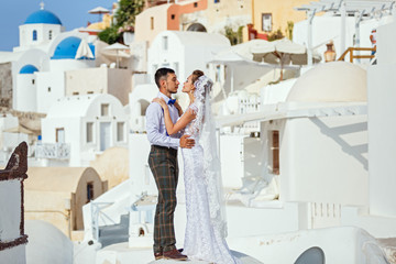 Young couple on Santorini island background