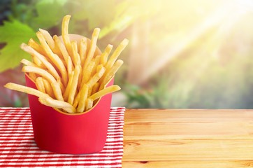 Wall Mural - French fries in a red carton box isolated on white