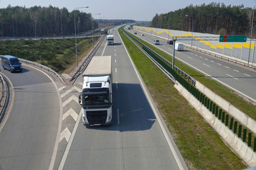 Various cars moving on the highway. Motorway node.