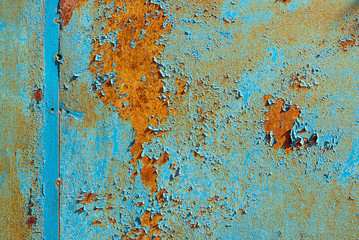 Wall Mural - Texture of rusty metal, painted blue which becames orange from rust. Horizontal texture of cracked paint on rusty steel