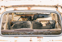 Old White Rusty Damaged Destroyed Car Left In An Old And Abandoned Garage In The Rural Countryside Of Tenerife.