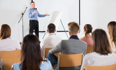 Wall Mural - Male coach giving presentation