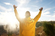 © mimagephotos - happy young african american man with arms raised in air outdoors