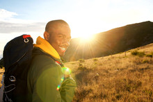 Close Up Side Of Happy Man Hiking In Mountains With Backpack