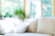 © Tierney - Blurred home interior background with couch and natural light