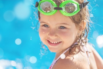 Poster - Beautiful little girl sunning at the pool