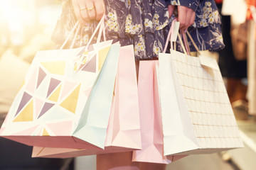 Happy woman shopping for clothes in store