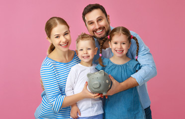 Wall Mural - financial planning happy family mother father and children with piggy Bank on pink .