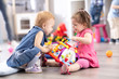 © Oksana Kuzmina - Conflict on the playground. Two kids fighting over a toy in kindergarten