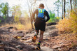 © tuiphotoengineer - A man Runner of Trail . and athlete's feet wearing sports shoes for trail running in the forest
