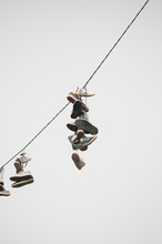 Hanging Shoes From A Wire.