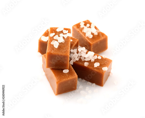 Fotografía Tasty salty caramel candies on white background