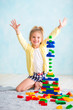© Yarkovoy - the girl built a tower of cubes. The joy of games