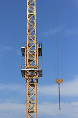 Construction crane against blue sky