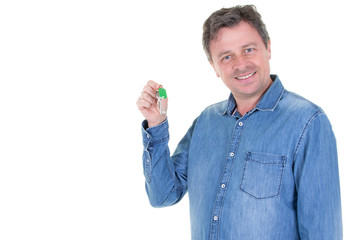 Smiling happy middle aged man holding keys