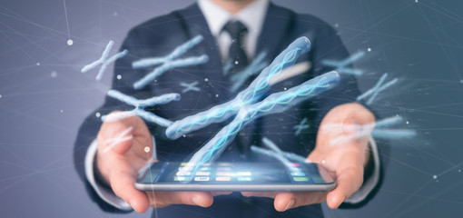 Businessman holding a Group of chromosome with DNA inside isolated on a background 3d rendering