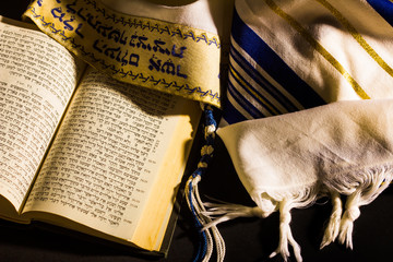 Hebrew prayer book and a tallit, a jewish prayer shawl