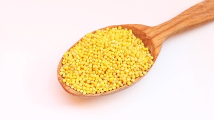 Wall Mural - Yellow wheat flour in a spoon