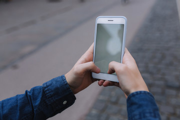 Mock up of man holding device and touch screen