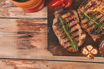 Wall Mural - Steak pork grill on wooden cutting board