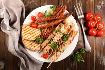 Canvas Print - assorted barbecue meat with sausage, pork chop and beef skewer