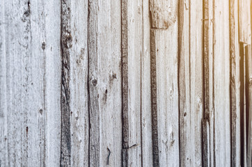 Wall of the old gray boards, damaged by climate. Vintage wood background. Rough work