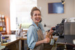© pikselstock - Woman working in coffee shop