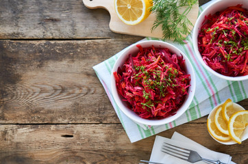 Wall Mural - Vegetable salad with beets, cabbage and carrots in a white bowl    