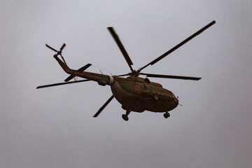 Wall Mural - Mi-8 helicopters in the cloudy sky