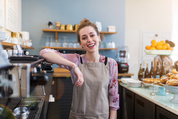 Wall Mural - Woman working in coffee shop