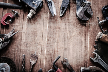 Wall Mural - grungy old tools on a wooden background