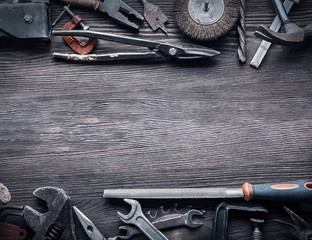 Poster - grungy old tools on a wooden background