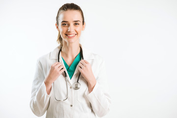 Wall Mural - Young nurse in a scrub uniform wearing a stethoscope.