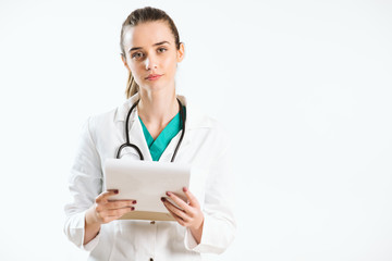 Wall Mural - Young nurse with stethoscope and papers in her scrub uniform.