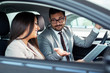© zorandim75 - Professional salesperson selling cars at dealership to buyer