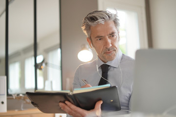 Businessman on video call in contemporary office