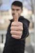 young businessman with thumb up