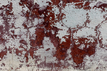 Wall Mural - Empty old art texture of plaster brick wall. Painted bad scratched surface in fissures of painted stucco of stone brick wall with petal texture. rubbed facade of building with damaged plaster