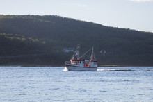 Fishing Boat On The Ocean. Fjord In Norway.